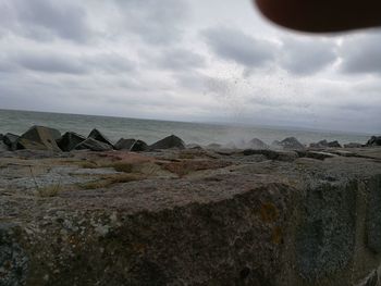 Scenic view of sea against cloudy sky