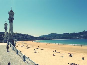 Scenic view of beach against clear blue sky