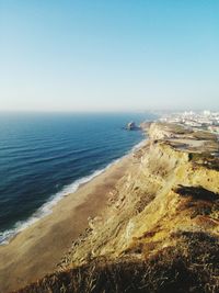 Scenic view of sea against clear blue sky