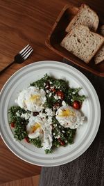 Tomato kale and feta poached eggs