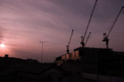 Buildings against sky at sunset