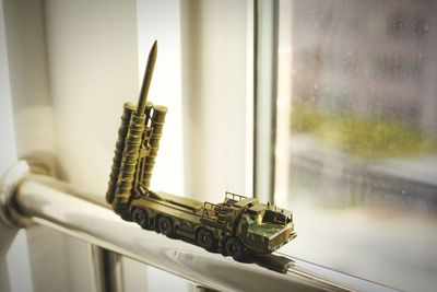 Close-up of toy by window