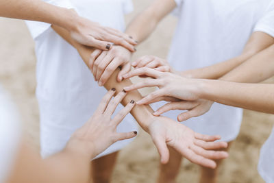 Midsection of woman holding hands