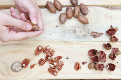 Close-up of hands holding walnuts