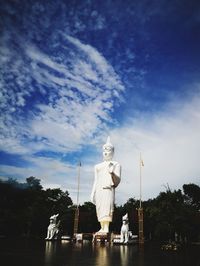 Low angle view of statue against cloudy sky