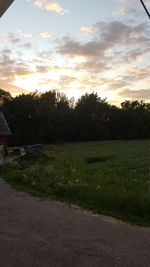 Scenic view of field against sky during sunset