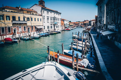 Boats moored at harbor