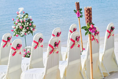 Scenic view of sea and white flowers