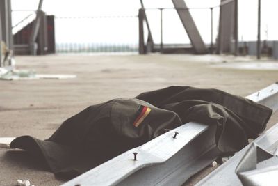 Rear view of woman sitting on bench