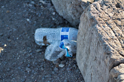 High angle view of garbage on rock