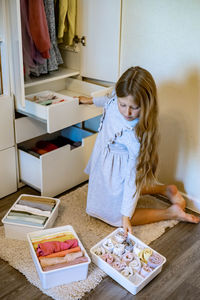 High angle view of girl drawing on table