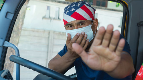 Portrait of man driving car