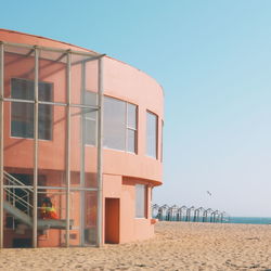 View of beach against clear blue sky