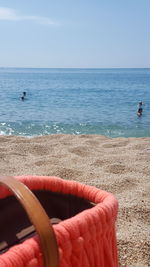 Close-up of red sea against sky