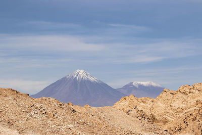 Panoramic view of volcanic landscape against sky