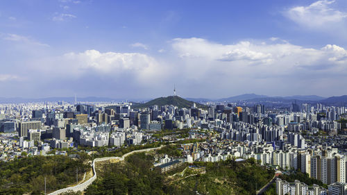 High angle view of city against cloudy sky