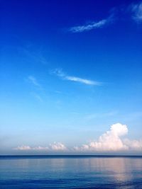 Scenic view of sea against blue sky