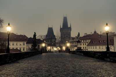 View of illuminated city at dusk