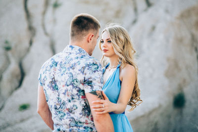 Young couple standing outdoors