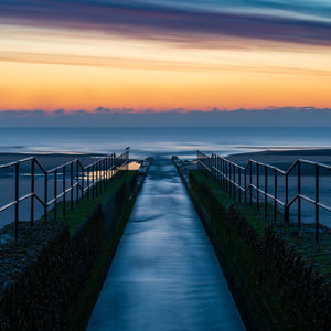 Scenic view of sea against sky during sunrise