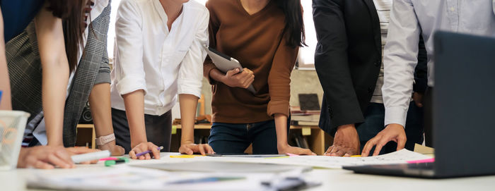 Group of people working on table