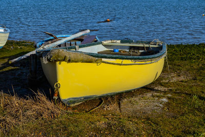 Boats moored on sea against sky