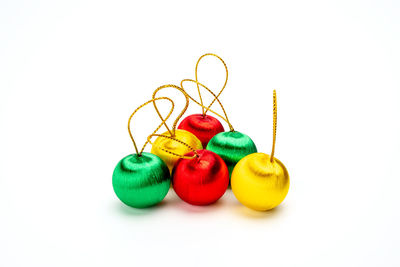 Close-up of multi colored candies against white background