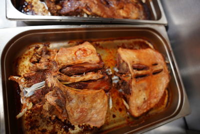 High angle view of meat in container on table