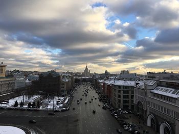 Cityscape against cloudy sky