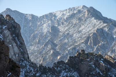 Low angle view of mountains during winter