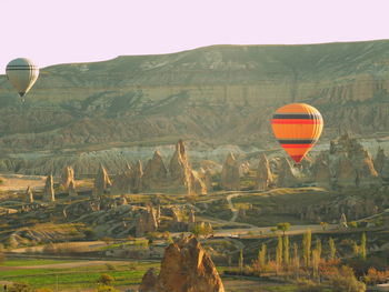 Hot air balloon flying over land