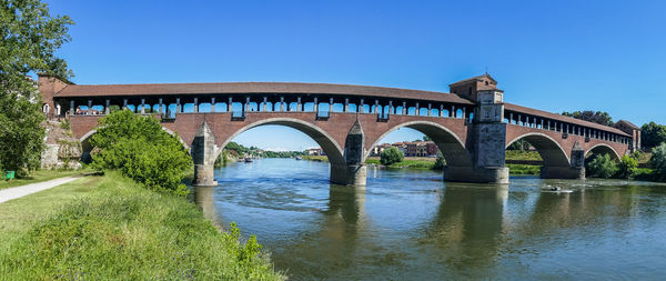 Covered bridge over the ticino river in pavia