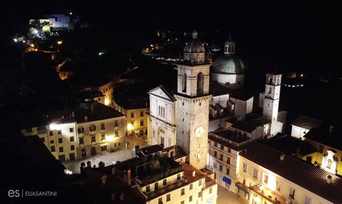 High angle view of illuminated buildings in city at night