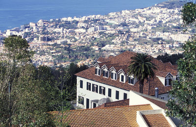 High angle view of residential district by sea