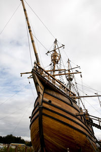 Low angle view of ship sailing against sky