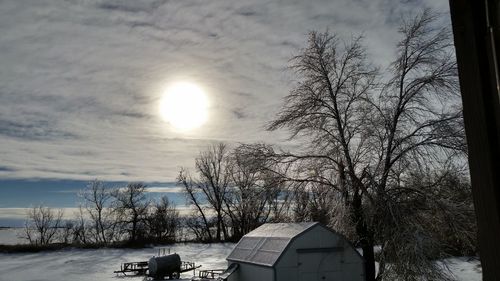 Snow covered landscape at sunset