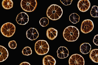 Close-up of grapefruits arranged over black background