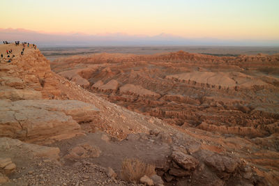 People after watching beautiful sunset at moon valley in atacama desert, san pedro atacama, chile