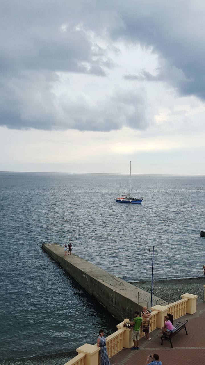 nautical vessel, transportation, sea, mode of transport, water, boat, horizon over water, sky, sailing, cloud - sky, scenics, nature, travel, tranquil scene, tranquility, beauty in nature, cloudy, day, men