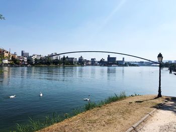 View of bridge over river in city