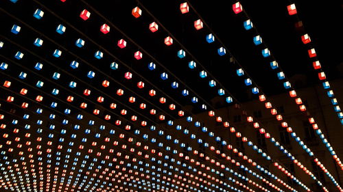 Close-up of illuminated lighting equipment at night