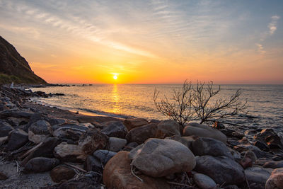 Scenic view of sea against sky during sunset