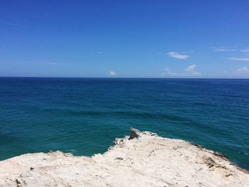 Scenic view of sea against blue sky