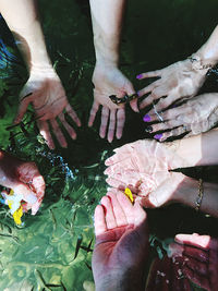 High angle view of people hands