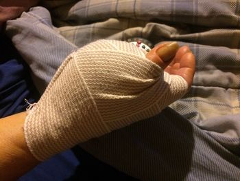 Cropped image of hand covered with bandage