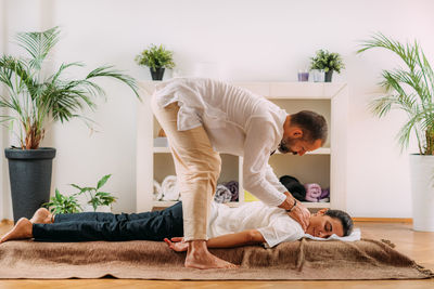 Woman enjoying shiatsu neck and shoulders massage.