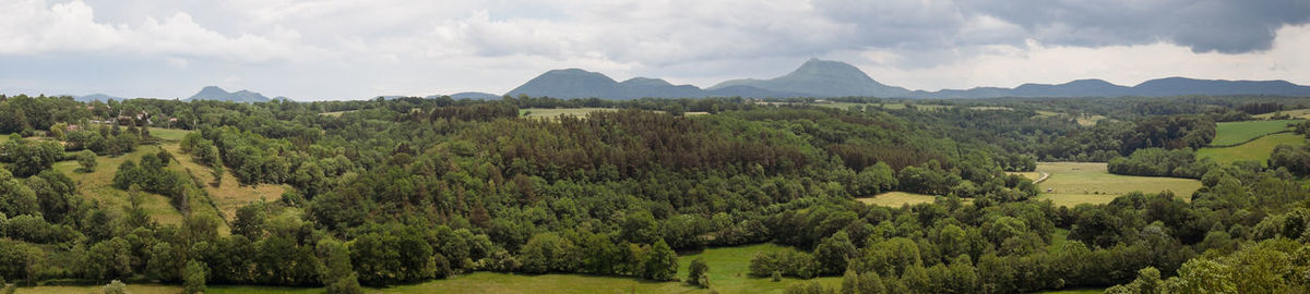 View of the chain of auvergne volcanoes under a thunderstorm