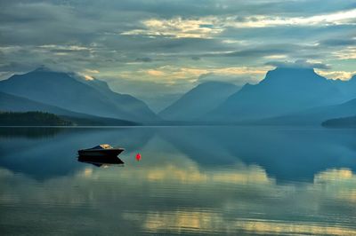 Scenic view of lake with mountains in background