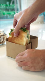 Close-up of hand holding sandwich