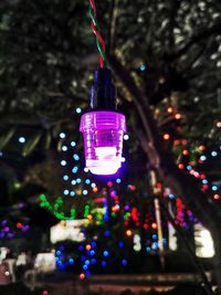Close-up of illuminated christmas lights on tree